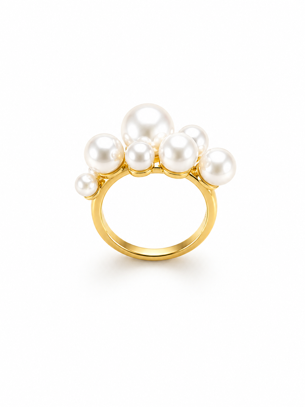 Gold multi pearl statement ring on white background